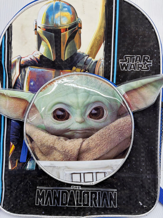 Star Wars Mandalorian backpack close-up front view showing Mandalorian helmet art and Grogu face front pocket with 3D ears