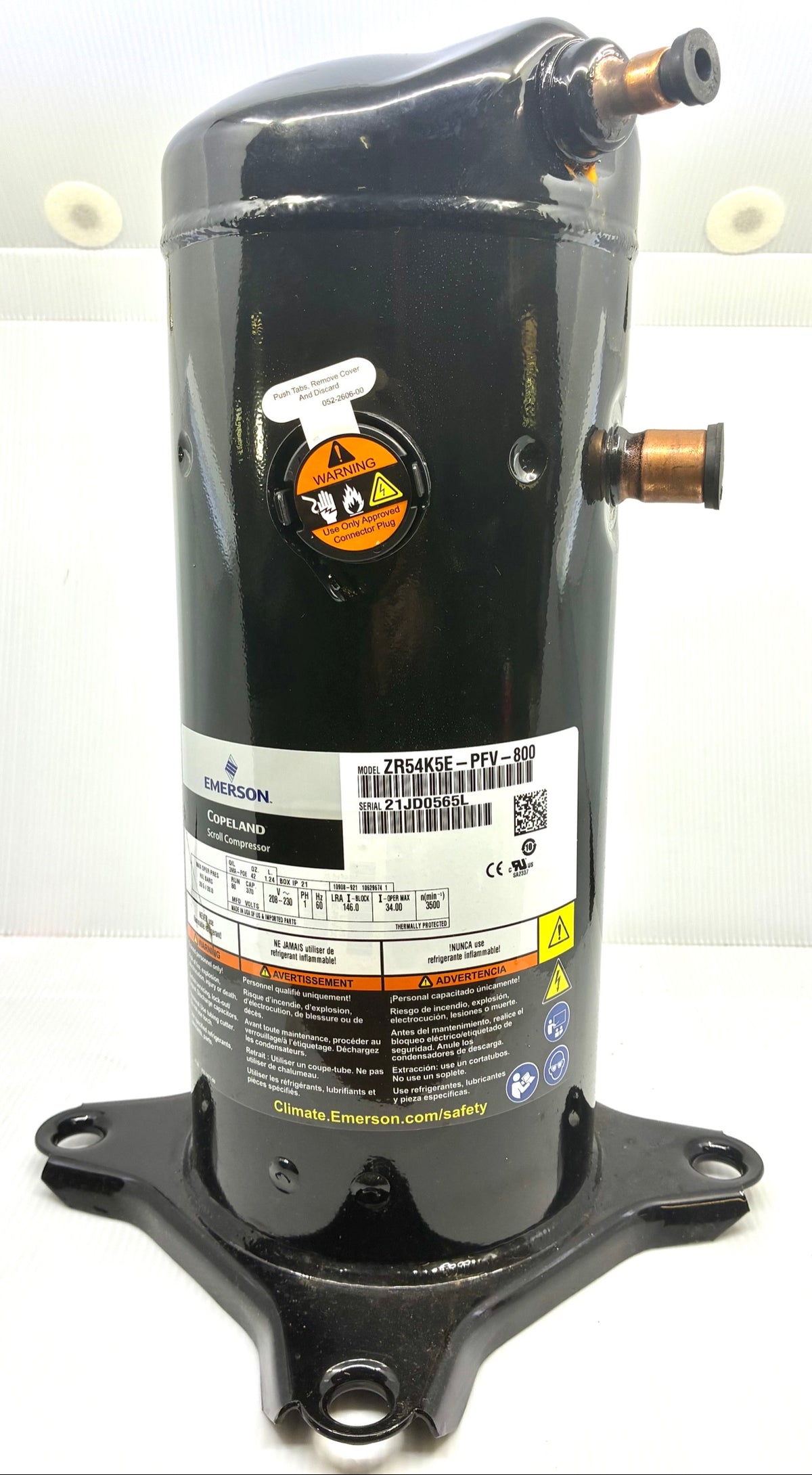 Emerson Copeland ZR54K5E-PFV-800 scroll compressor front view with nameplate, serial 21JD0565L, capped suction and discharge stubs