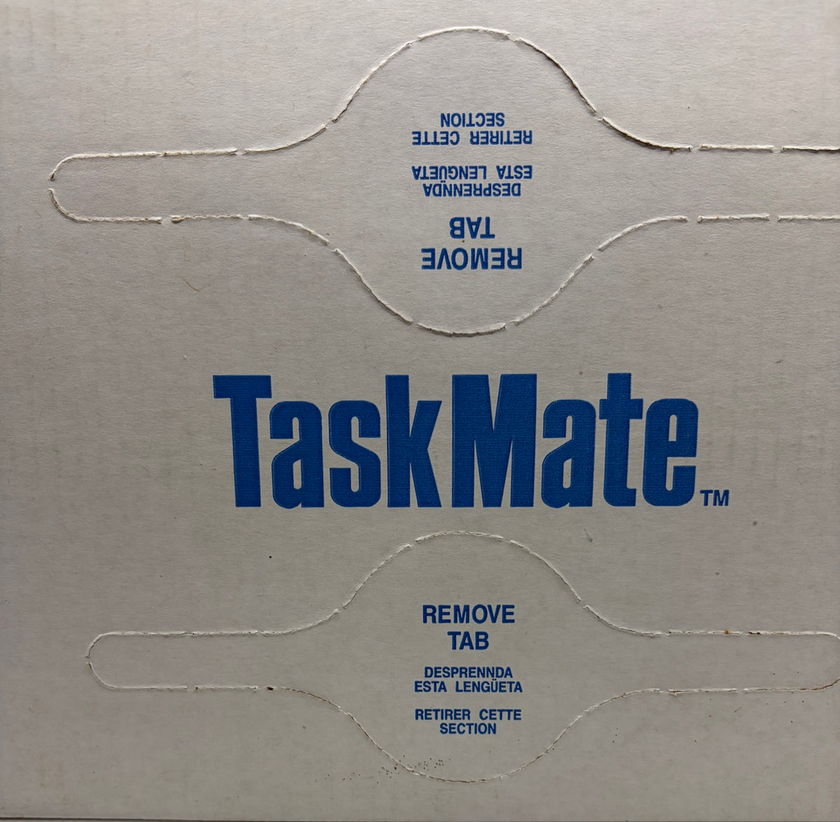 TaskMate dispenser box top with remove-tab pop-up opening instructions in English, Spanish and French