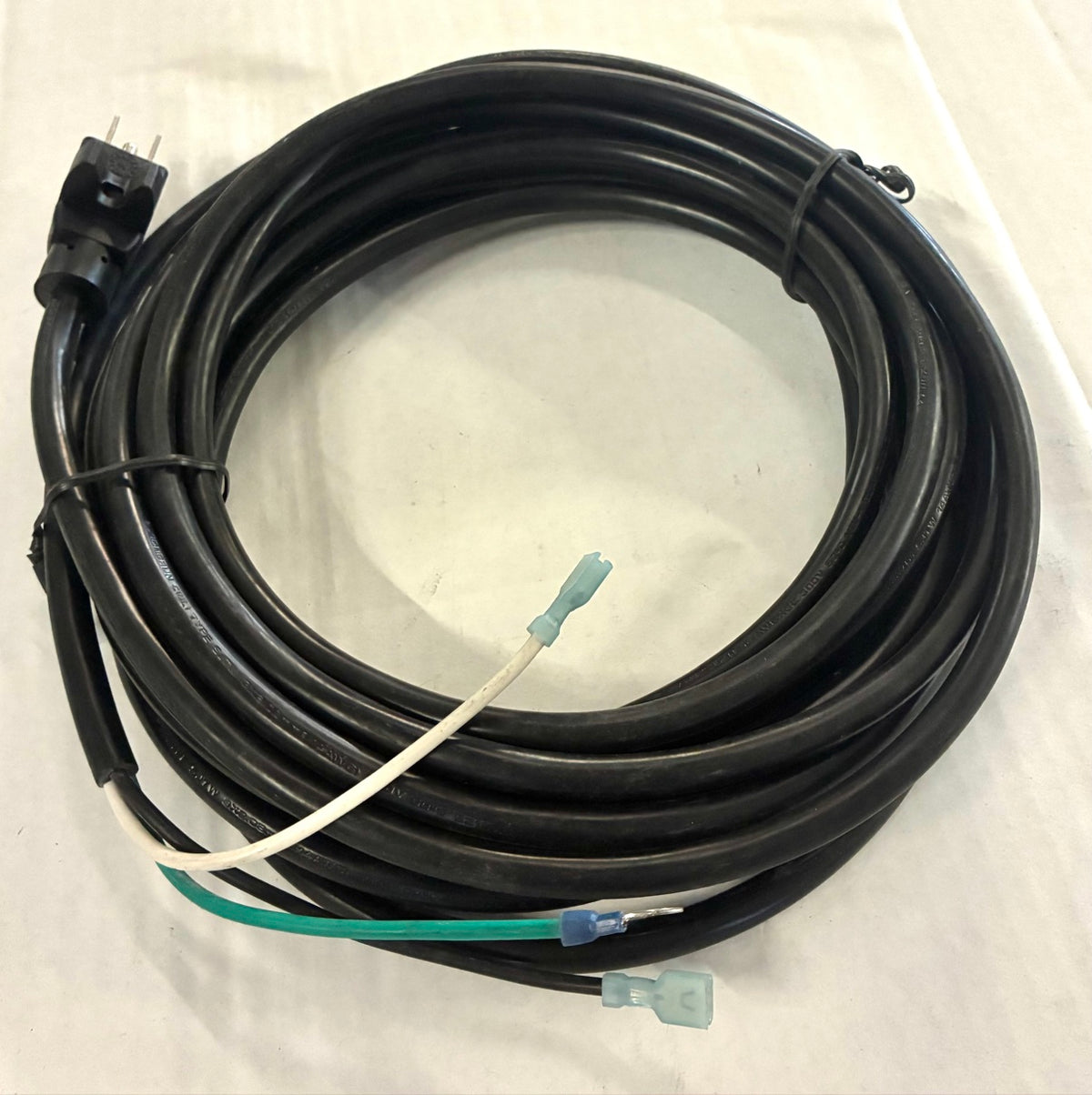Power cord coil top view with 3-prong plug and quick-disconnect terminal leads