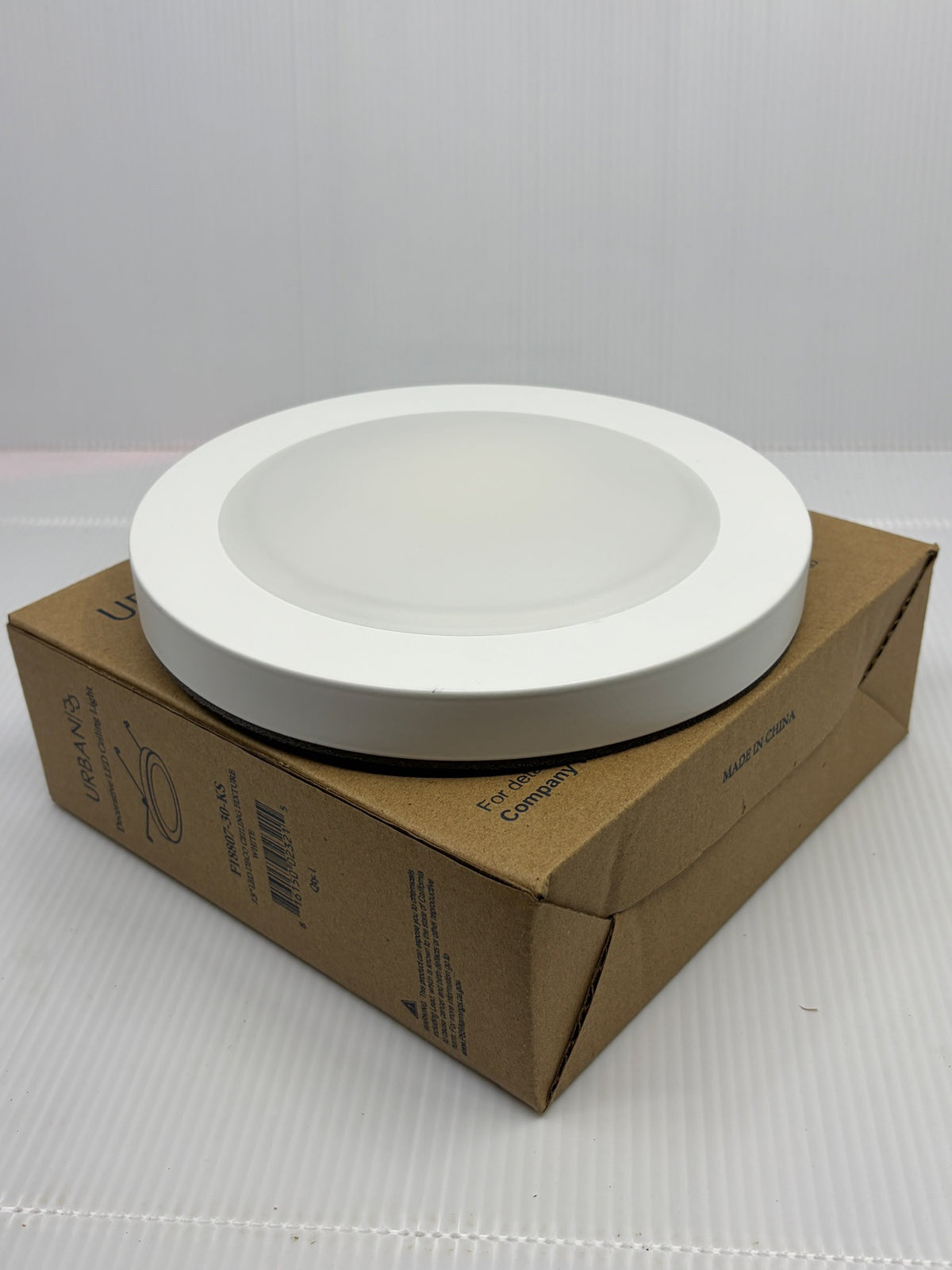 Urban 33 7.5 inch LED deco ceiling fixture F18807-30-KS in white, shown on its retail box
