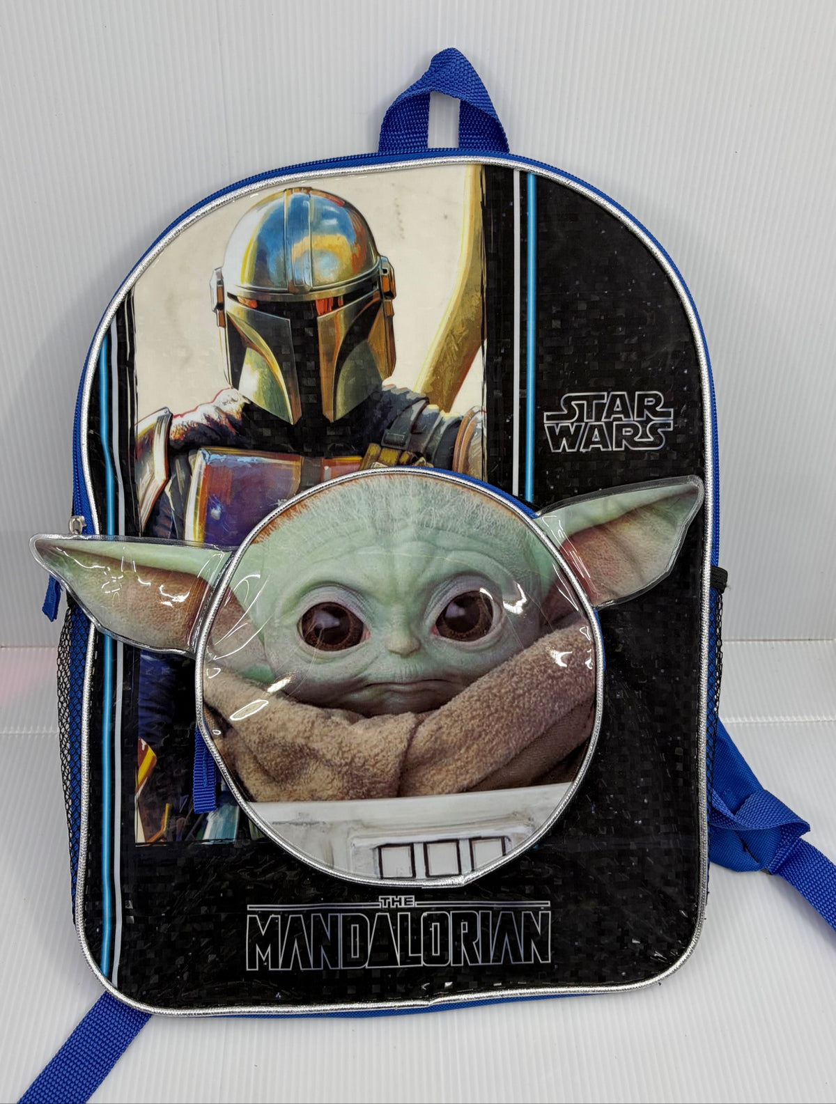 Full front view of the Star Wars Mandalorian Grogu backpack with 3D ears pocket, mesh side pockets and blue straps