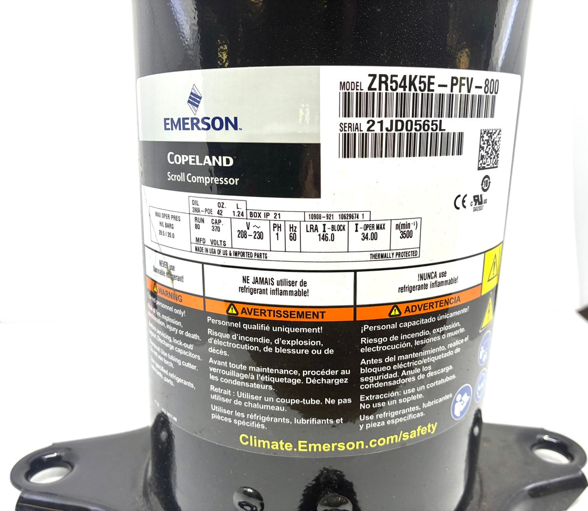Close-up of Copeland ZR54K5E-PFV-800 nameplate showing model, serial 21JD0565L, 208-230V 1 phase 60Hz, LRA 146, POE oil 42 oz