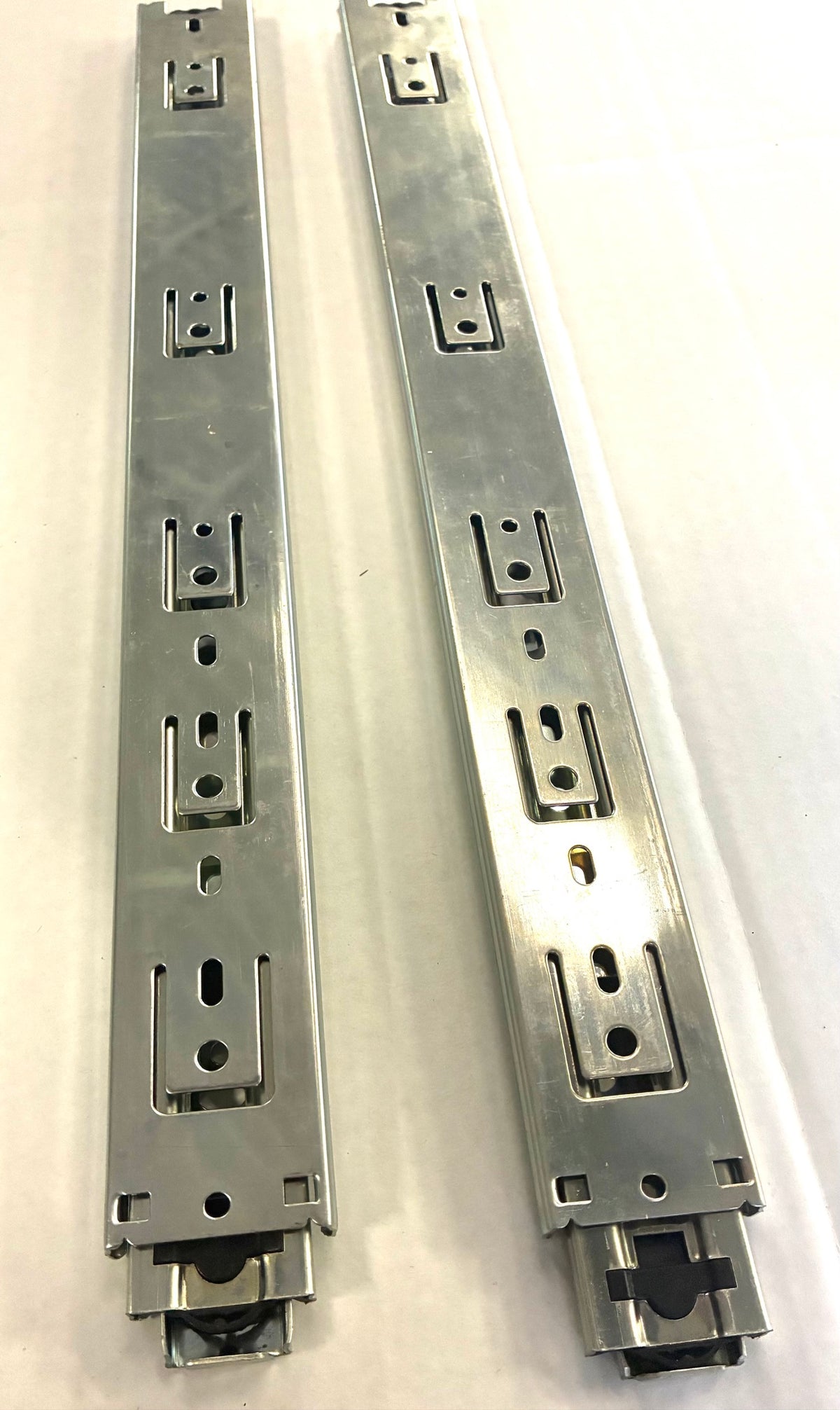 Fulterer FR 5000 drawer slides angled view showing screw hole access windows and rear hold-close detent