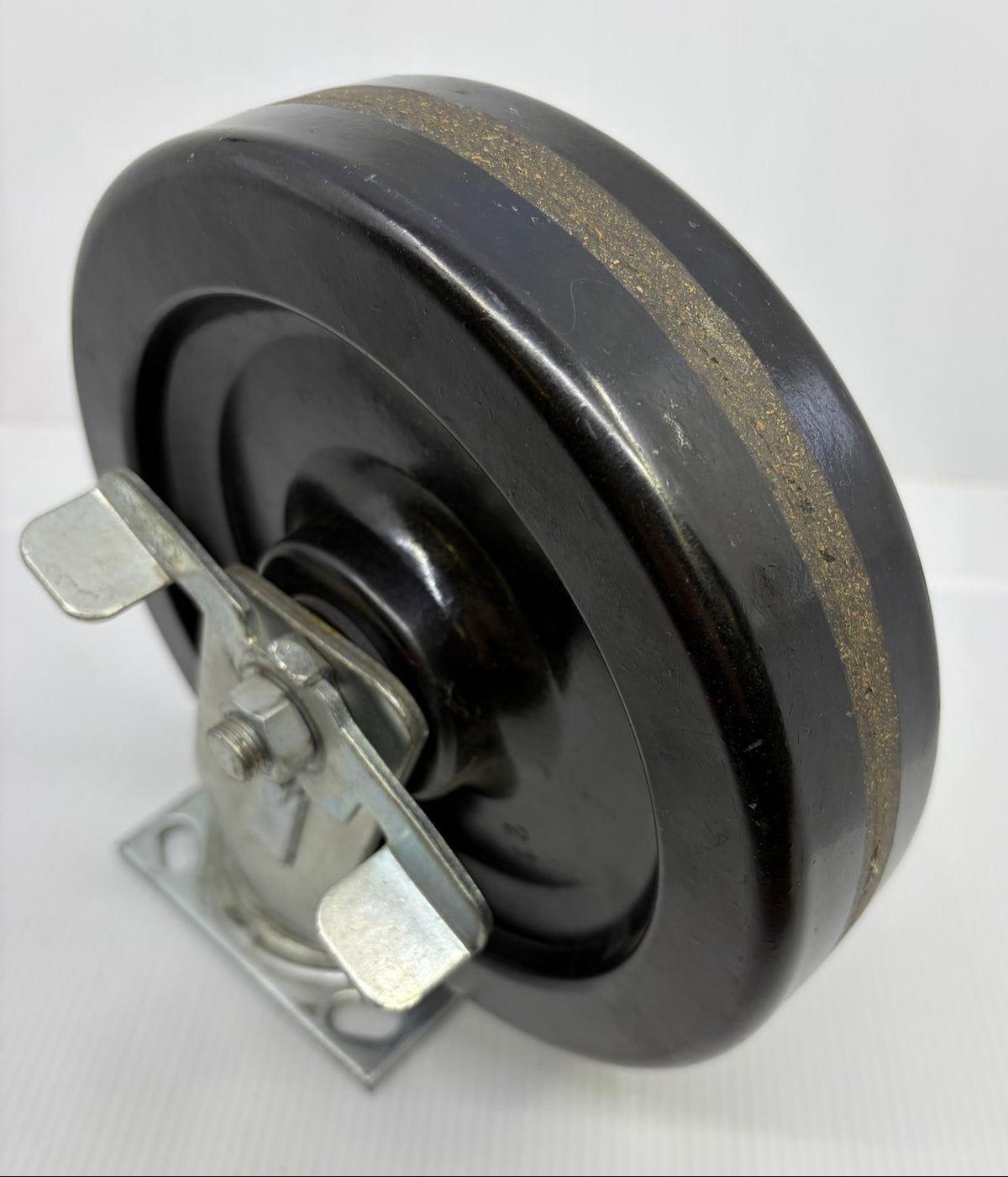 Faultless phenolic caster wheel tread showing brown macerated fabric reinforcement band, three-quarter view