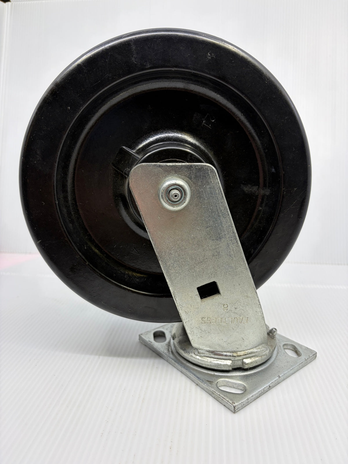 Faultless 8 inch swivel caster opposite side, zinc fork leg and axle grease fitting