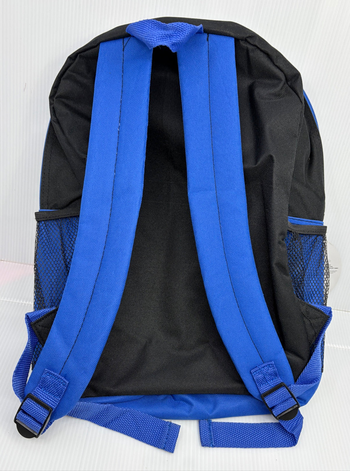 Back view of the Mandalorian backpack showing black back panel and blue adjustable shoulder straps