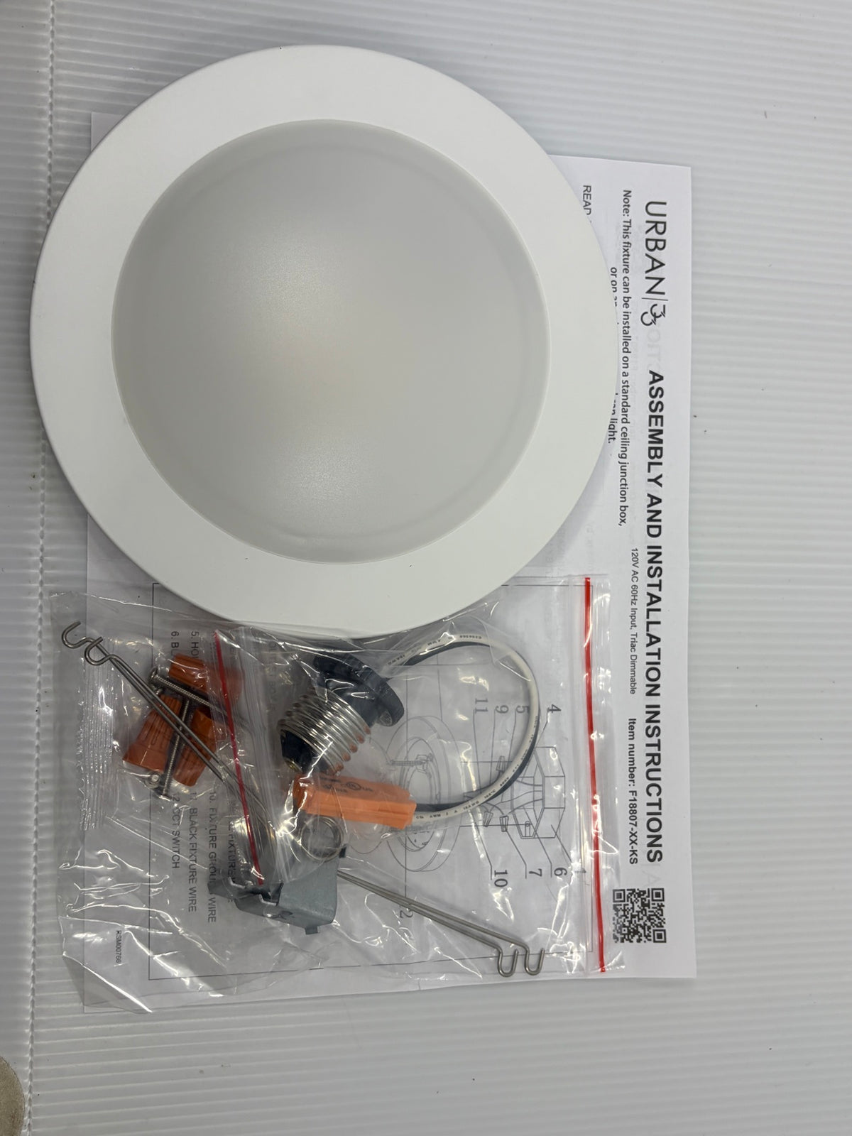Urban 33 LED disk light kit contents - fixture, E26 medium base adapter, spring clips, wire nuts, screws and installation instructions