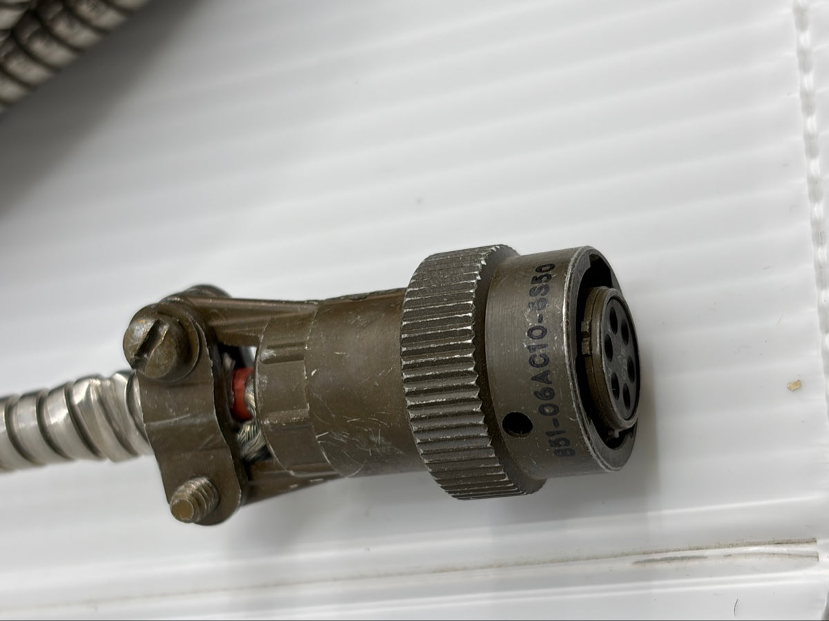 Close-up of Souriau 851-06AC10-6S50 part number stamped on bayonet coupling nut, 6-socket insert