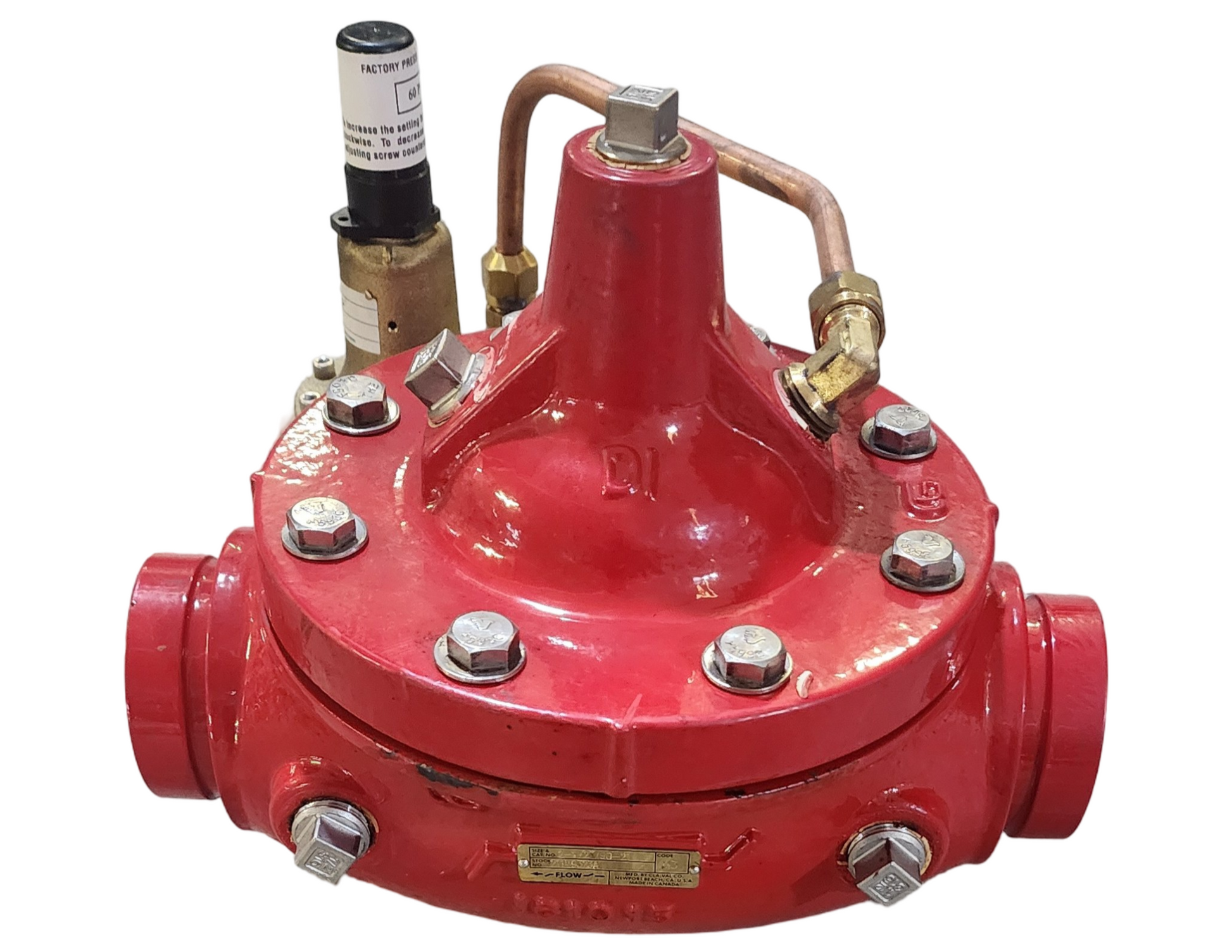 Red industrial valve with multiple connections on a white background
