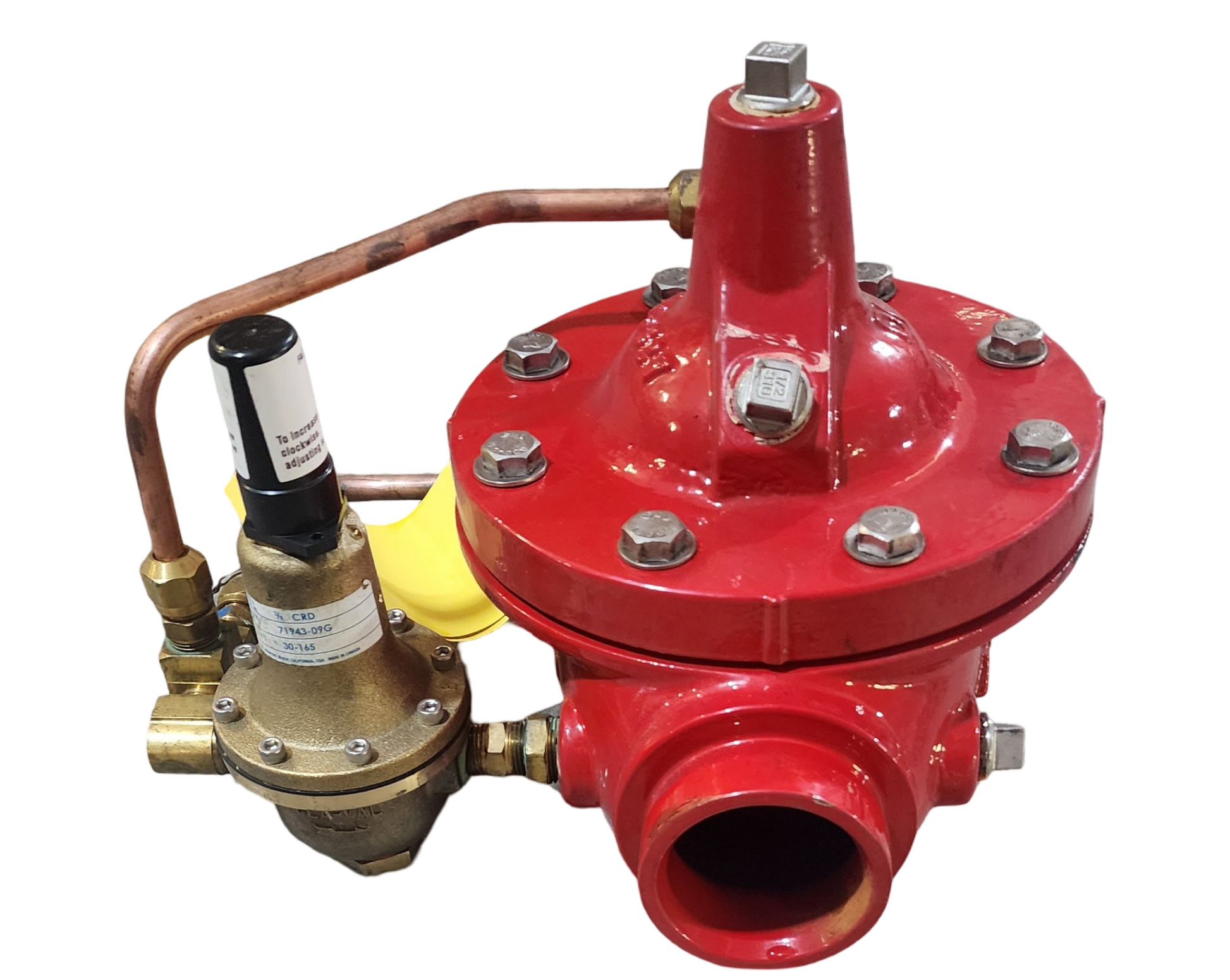Red and brass valve with multiple connections on a white background