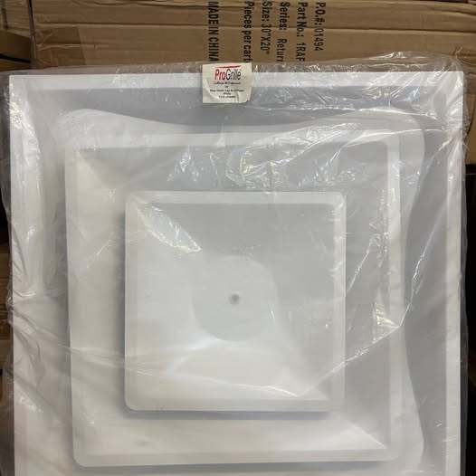White plastic tray with ProGrill label on a cardboard box background