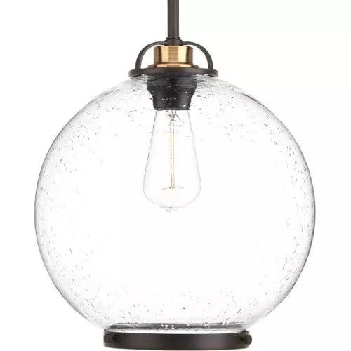 Antique bronze pendant light with a clear seeded glass globe shade and metal accent ring.