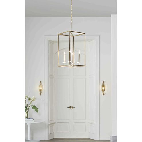 Gold pendant light fixture in a room with white walls and a door.
